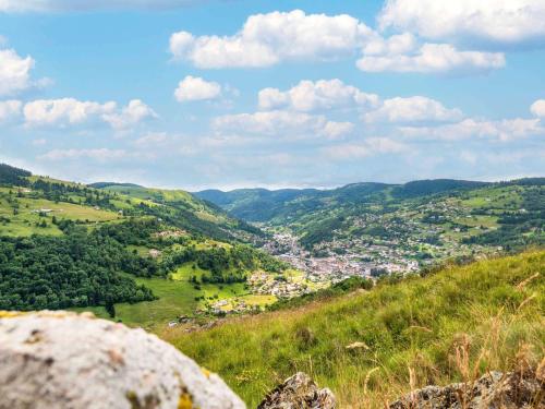 a view of a town from a hillside at ibis La Bresse Gérardmer in La Bresse