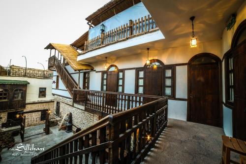an image of a house with stairs and a balcony at Sillehan Boutique Hotel in Konya