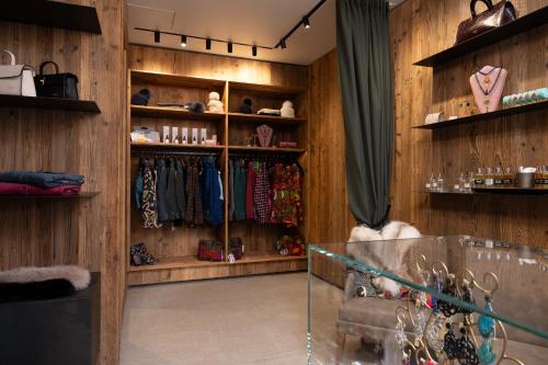 a room with wooden walls and shelves with clothes at Grand Hotel Courmayeur Mont Blanc, by R Collection Hotels in Courmayeur