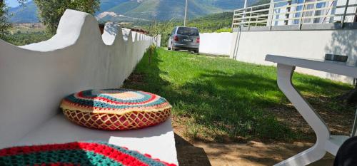 a bowl sitting on a table next to a wall at Villa Ermis in Dhërmi