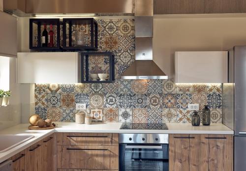 a kitchen with a sink and a stove at Chris & Jo Villas, Enchanting Escapes, with Heated Pools & SeaViews By ThinkVilla in Zakynthos Town