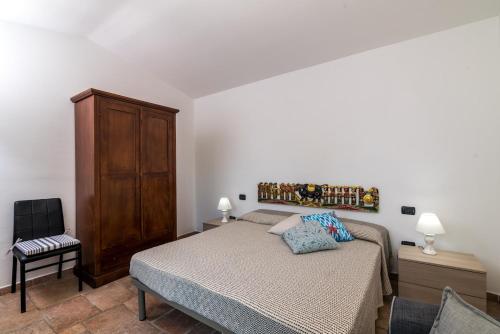 Ένα ή περισσότερα κρεβάτια σε δωμάτιο στο Villetta Carlotta in residence