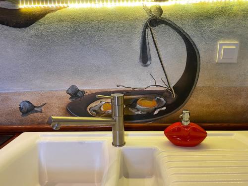 a sink with a faucet on top of it at Dali Deluxe , parking, faktura VAT in Koszalin