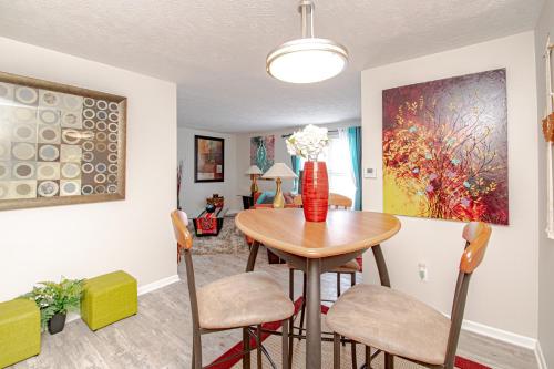 a dining room with a table and chairs at Lovely Eclectic Duplex - Peaceful Neighborhood in Trotwood