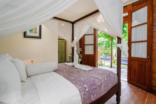 Postel nebo postele na pokoji v ubytování Ribka's Hotel Banda Neira