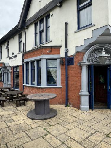 a picnic table in front of a building at The Holystone Bar and Restaurant in Newcastle upon Tyne