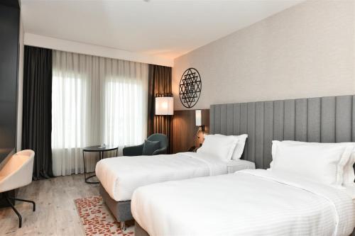 En eller flere senge i et værelse på Crowne Plaza Ankara by IHG