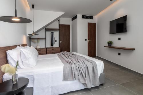 Postel nebo postele na pokoji v ubytování Almos Villas