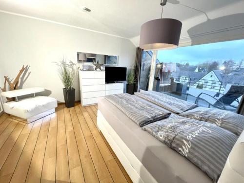 Ένα ή περισσότερα κρεβάτια σε δωμάτιο στο Ferienwohnung Strandperle - nur 150m zum Strand