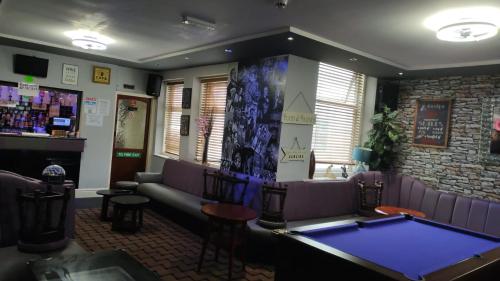 a billiard room with a pool table in a bar at The Chorlton in Blackpool