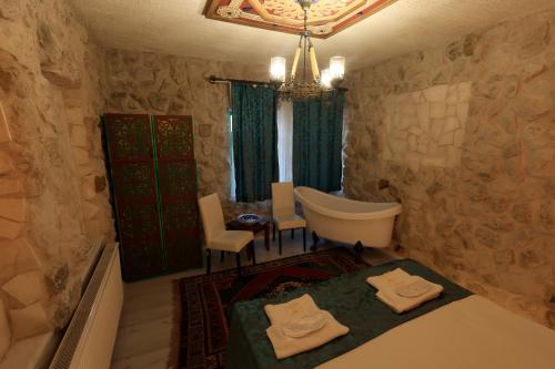 Кровать или кровати в номере KEMAL STONE HOUSE HOTEL.