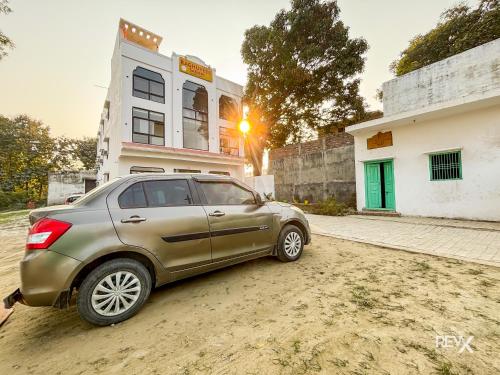 a car parked in front of a building at Raghuveer Sadan, Near Ram Mandir -10 Min Walk in Ayodhya
