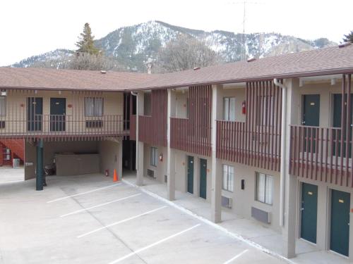 arial view of a building with mountains in the background at Bear Lodge Motel in Sundance