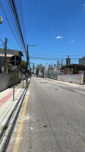 an empty street with a city in the background at Casa de temporada em Balneário Camboriú à 10 minutos da praia in Balneário Camboriú