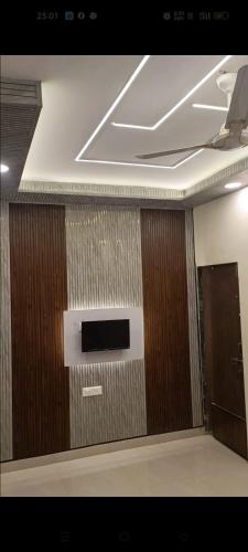 a room with a wall with a wall mounted television at Sea View Villa in Kondivli