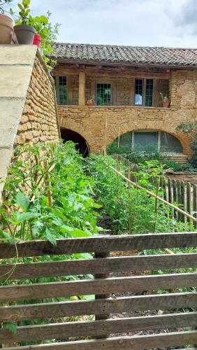 a set of stairs in front of a house at Gite dans maison médiévale Calme Fibre 2 ch in Jarnioux