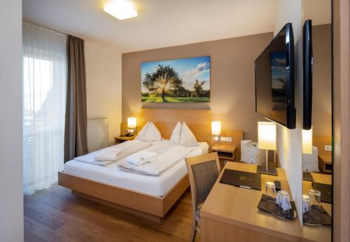 Postel nebo postele na pokoji v ubytování Vital-Hotel-Styria