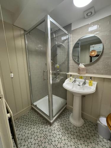 a bathroom with a shower and a sink at The White Horse in Faversham