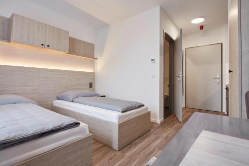 Postel nebo postele na pokoji v ubytování Bader Aparthotel