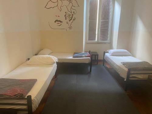 Postel nebo postele na pokoji v ubytování Minerva Rooms