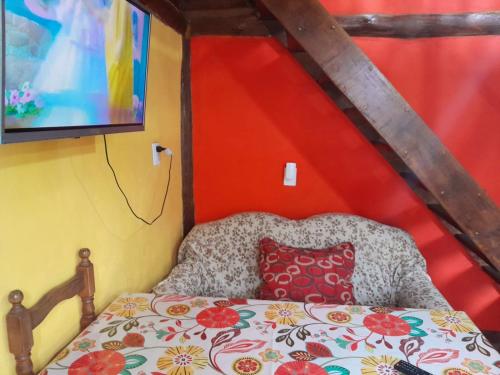 a bedroom with a bed with a pillow on it at Cábañas el Descanso in Mar del Plata