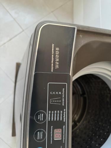 a close up of a toaster oven with its control panel at Eastern City Apartments in Dodoma