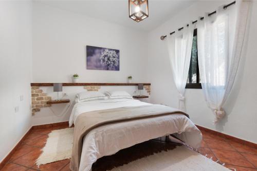 Postel nebo postele na pokoji v ubytování Casa Rural Kiko
