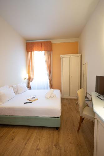 Ένα ή περισσότερα κρεβάτια σε δωμάτιο στο Hotel Pallanza by LVG Hotel Collection