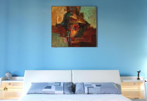 Ein Bett oder Betten in einem Zimmer der Unterkunft FALSTAFF Rooms & Suites