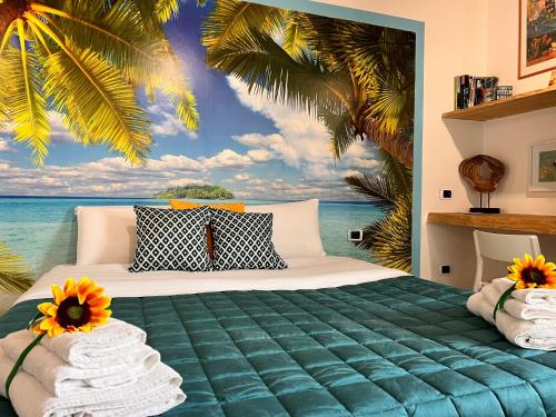 a bedroom with a bed with a mural of the ocean at Pompei Sunday Estate Exclusive Apartaments in Pompei