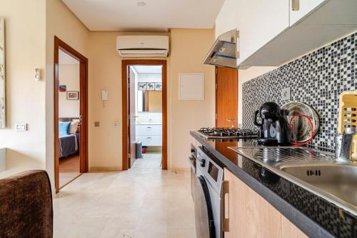 Kuchyň nebo kuchyňský kout v ubytování Cozy Atlas Golf Studio Prestigia Marrakech