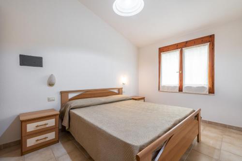 Ένα ή περισσότερα κρεβάτια σε δωμάτιο στο Casa Vacanze dei Pini