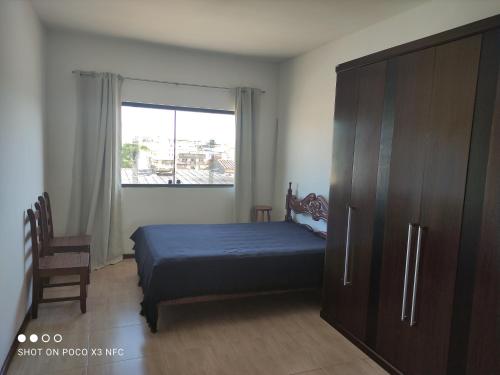 Postel nebo postele na pokoji v ubytování Excelente suíte próximo ao centro