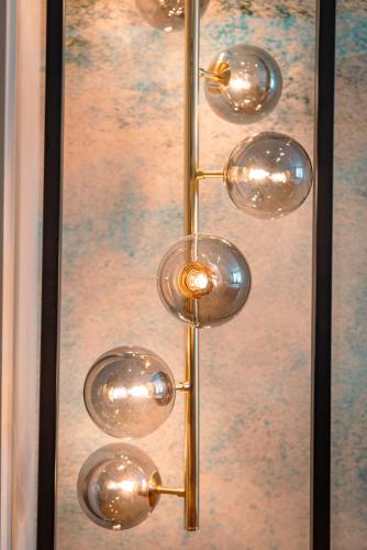 a bunch of glass knobs in a glass case at Alte Konditorei in Lindau
