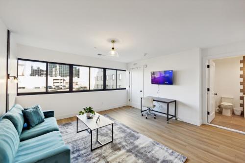 a living room with a couch and a table at Stunning 1bd1bth I New Construction in Wilmington
