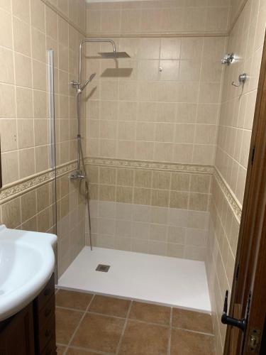 a bathroom with a shower and a sink at El Rincón de Caminito del Rey in Valle de Abdalagís