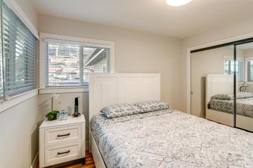 a bedroom with a bed and a mirror at 2 Mi to Beach Home with Patio in Del Rey Oaks! in Del Rey Oaks