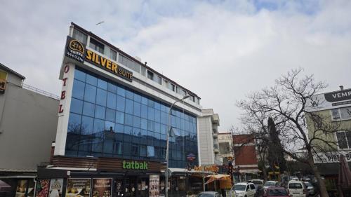 a building with a sign on it on a city street at 216 Silver Suite in Tuzla