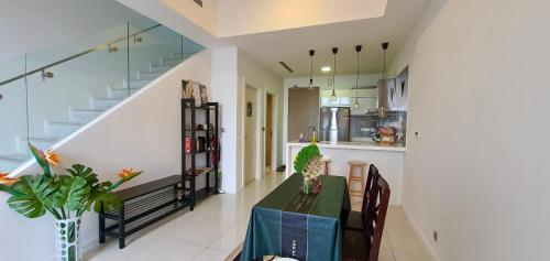 a kitchen and dining room with a table and chairs at M CITY AMPANG, KLCC pool view in Kuala Lumpur