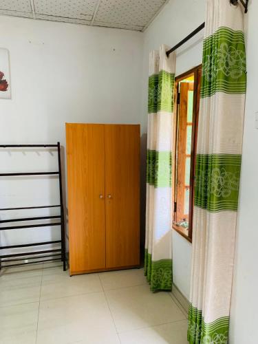 Un ou plusieurs lits dans un hébergement de l'établissement Dambulla Shan Inn