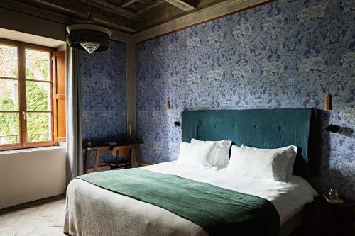 Postel nebo postele na pokoji v ubytování Pieve Aldina Relais & Châteaux