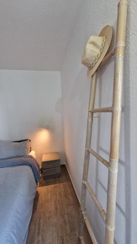 a room with a ladder next to a bed at Wind House in Costa de Antigua