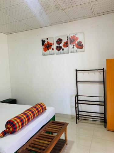 Un ou plusieurs lits dans un hébergement de l'établissement Dambulla Shan Inn