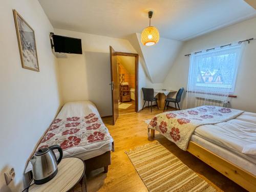 Posteľ alebo postele v izbe v ubytovaní Willa Konda - bania , sauna