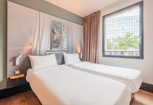 Postel nebo postele na pokoji v ubytování B&B HOTEL Mulhouse Centre