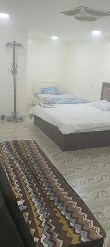 Voodi või voodid majutusasutuse Nizwa CIT toas