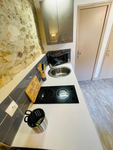 a kitchen with a sink and a counter top at Le Studio du Vieux-Mans - 2 guests - Wifi in Le Mans