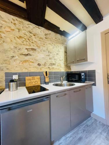 a kitchen with a sink and a counter top at Le Studio du Vieux-Mans - 2 guests - Wifi in Le Mans