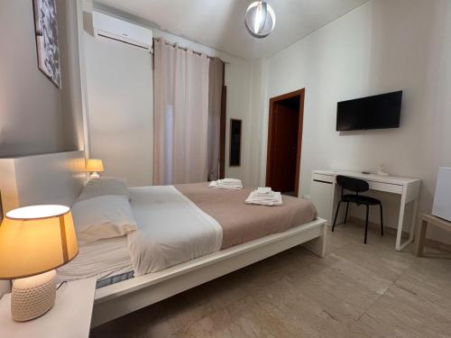 Postel nebo postele na pokoji v ubytování Vespro Guest House