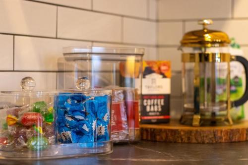 a counter top with a blender and some food items at Studio 2A Private Parking in Bedworth